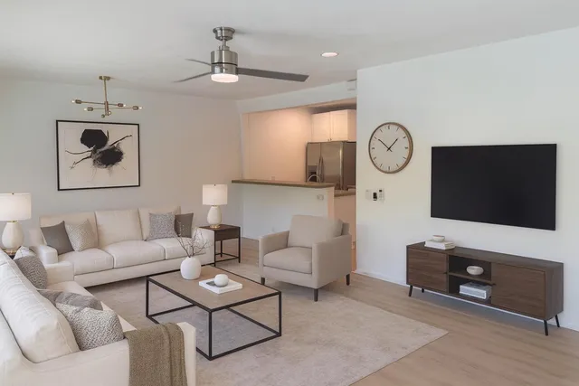 a view of a kitchen with a sink and wooden floor