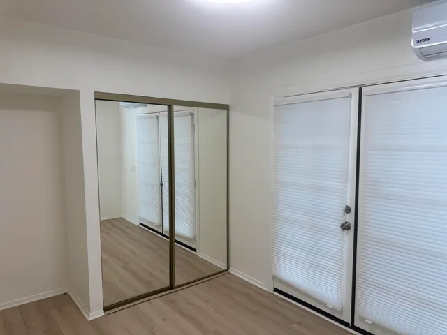 a view of a backyard with a table and chairs