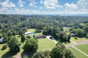 a view of a hallway with wooden floor and entryway