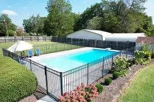 a view of a terrace with swimming pool and patio