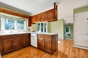 a view of a room with wooden floor and bathroom