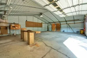 a view of a backyard with swimming pool and deck