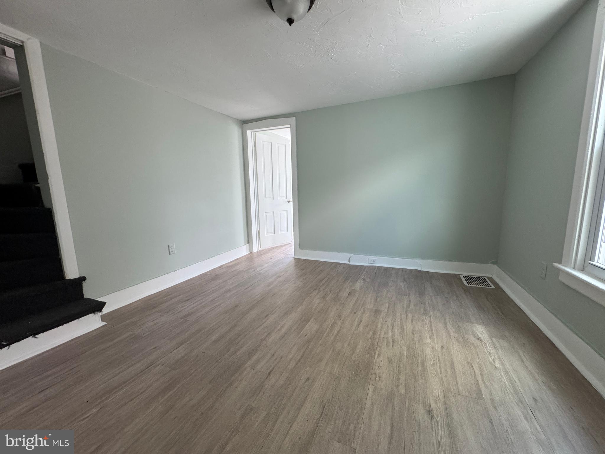 3754 Baltimore Pike, Unit 3 Littlestown, PA 17340 - Photo 12 of 21 an empty room with wooden floor and windows
