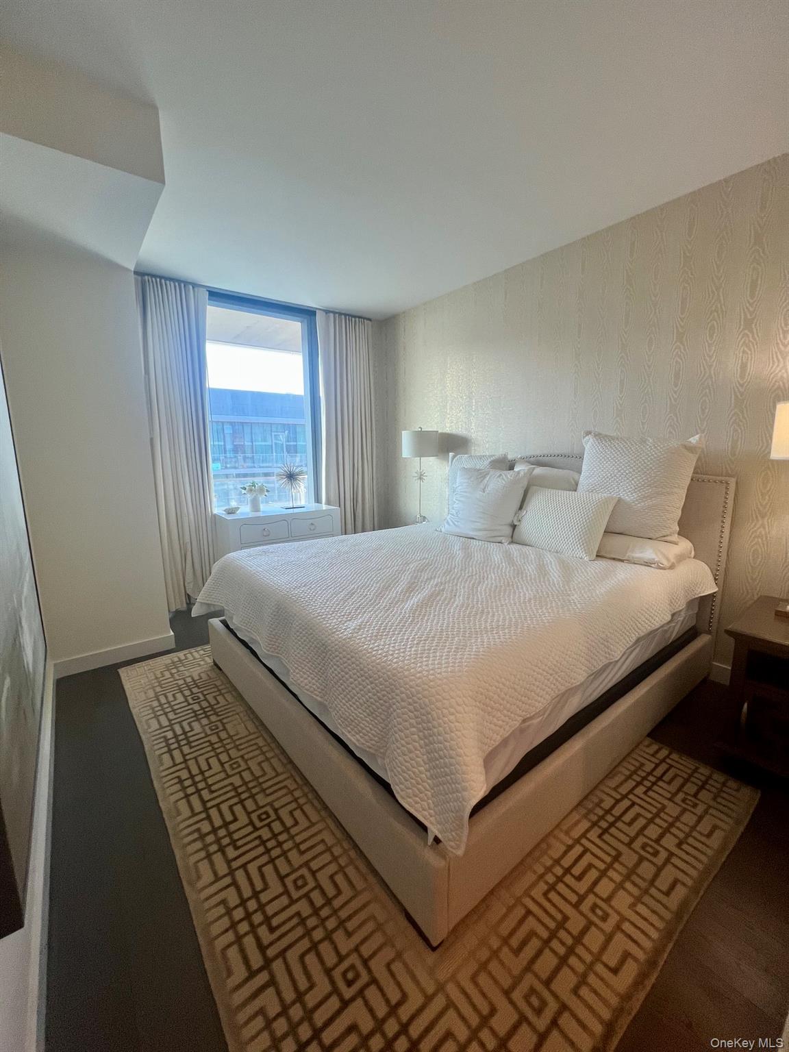 131-03 40 Road, Unit PH2G Queens, NY 11354 - Photo 13 of 29 a bedroom with a bed and window