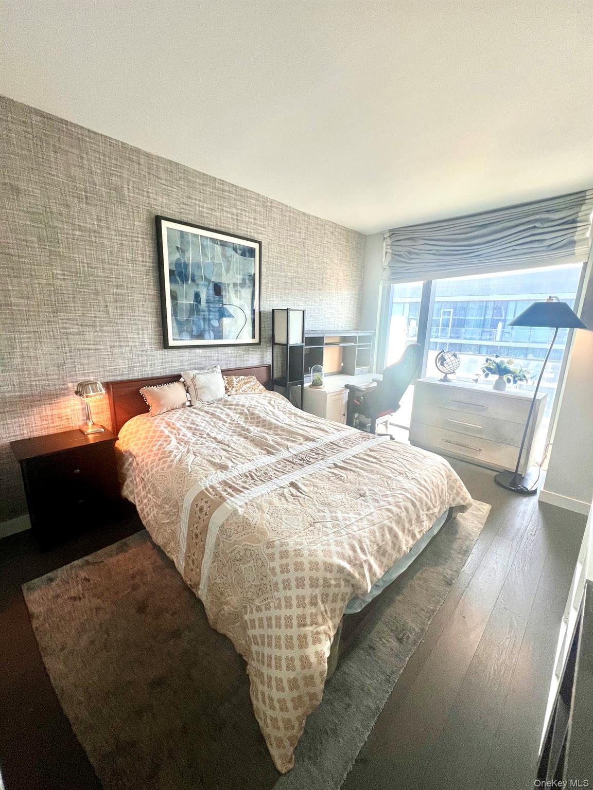 131-03 40 Road, Unit PH2G Queens, NY 11354 - Photo 8 of 29 a bedroom with a bed and wooden floor