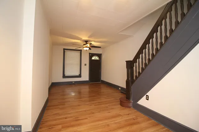 a view of an entryway with wooden floor