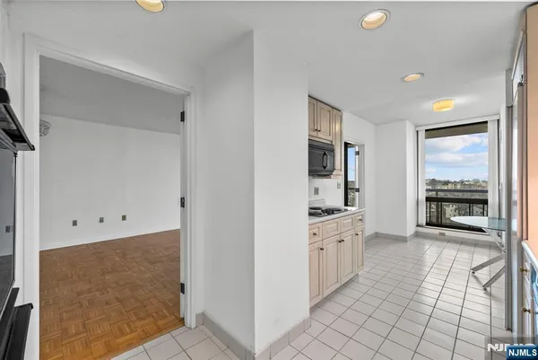 a kitchen with granite countertop a sink and a stove