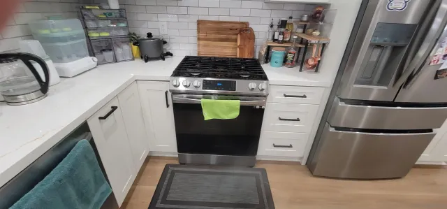 a kitchen with appliances and cabinets