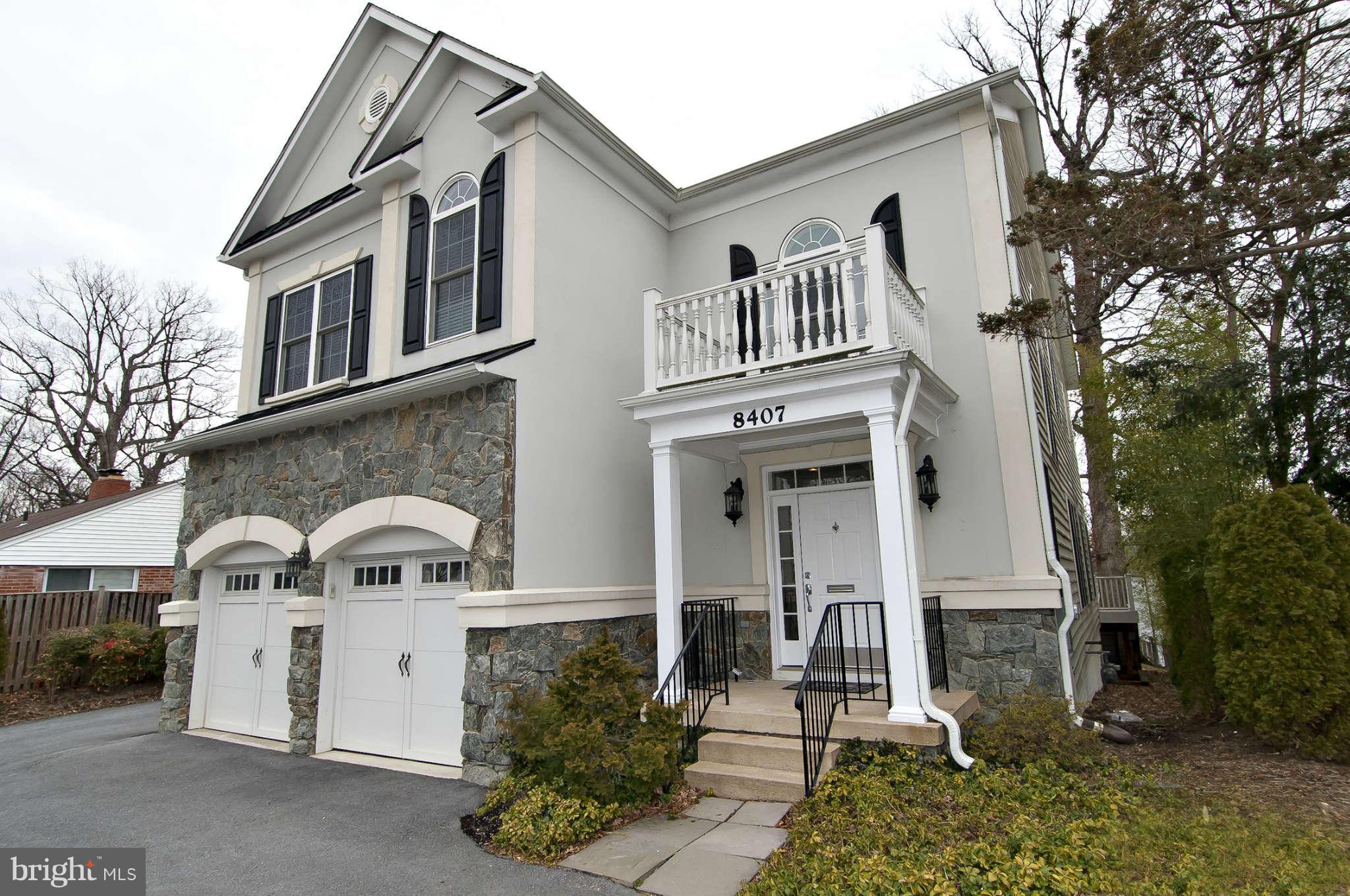 8407 Old Georgetown Road Bethesda, MD 20814 - Photo 1 of 30 a front view of a house with a yard