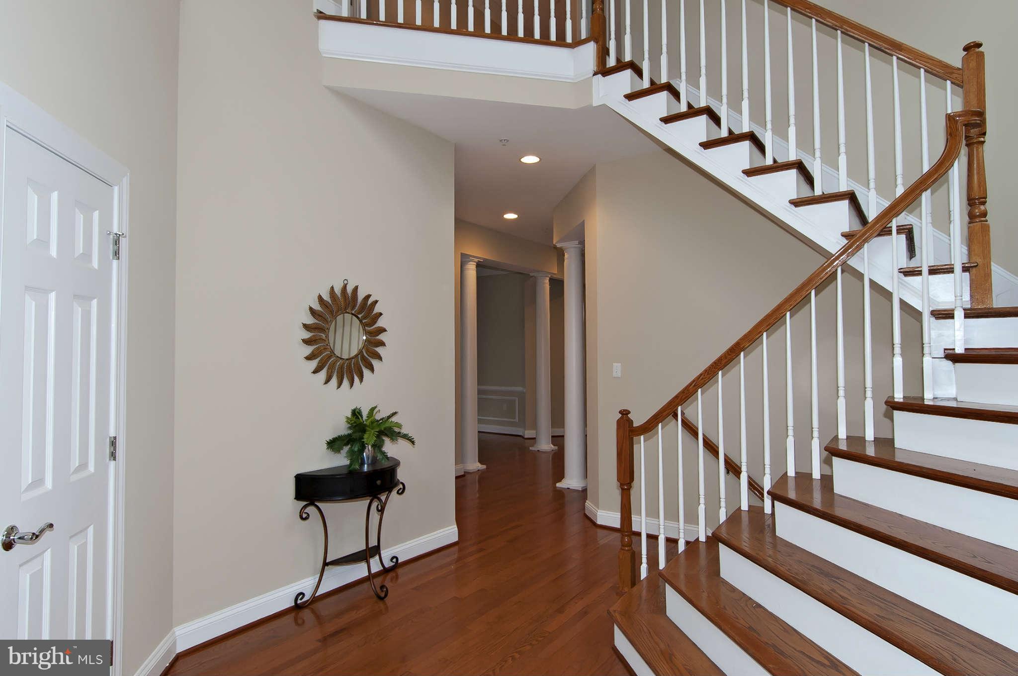 8407 Old Georgetown Road Bethesda, MD 20814 - Photo 2 of 30 a view of entryway with wooden floor and stairs