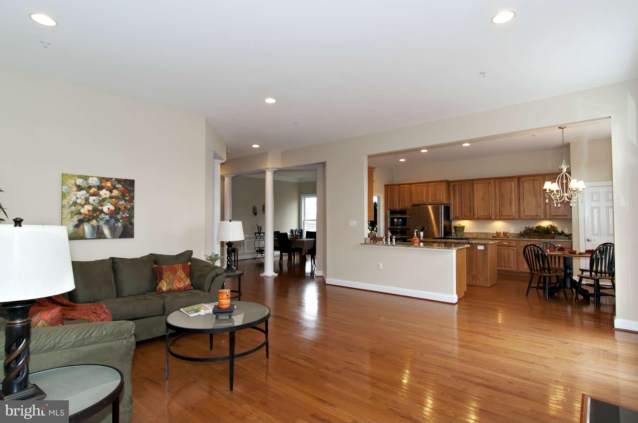 8407 Old Georgetown Road Bethesda, MD 20814 - Photo 11 of 30 a living room with furniture and kitchen view