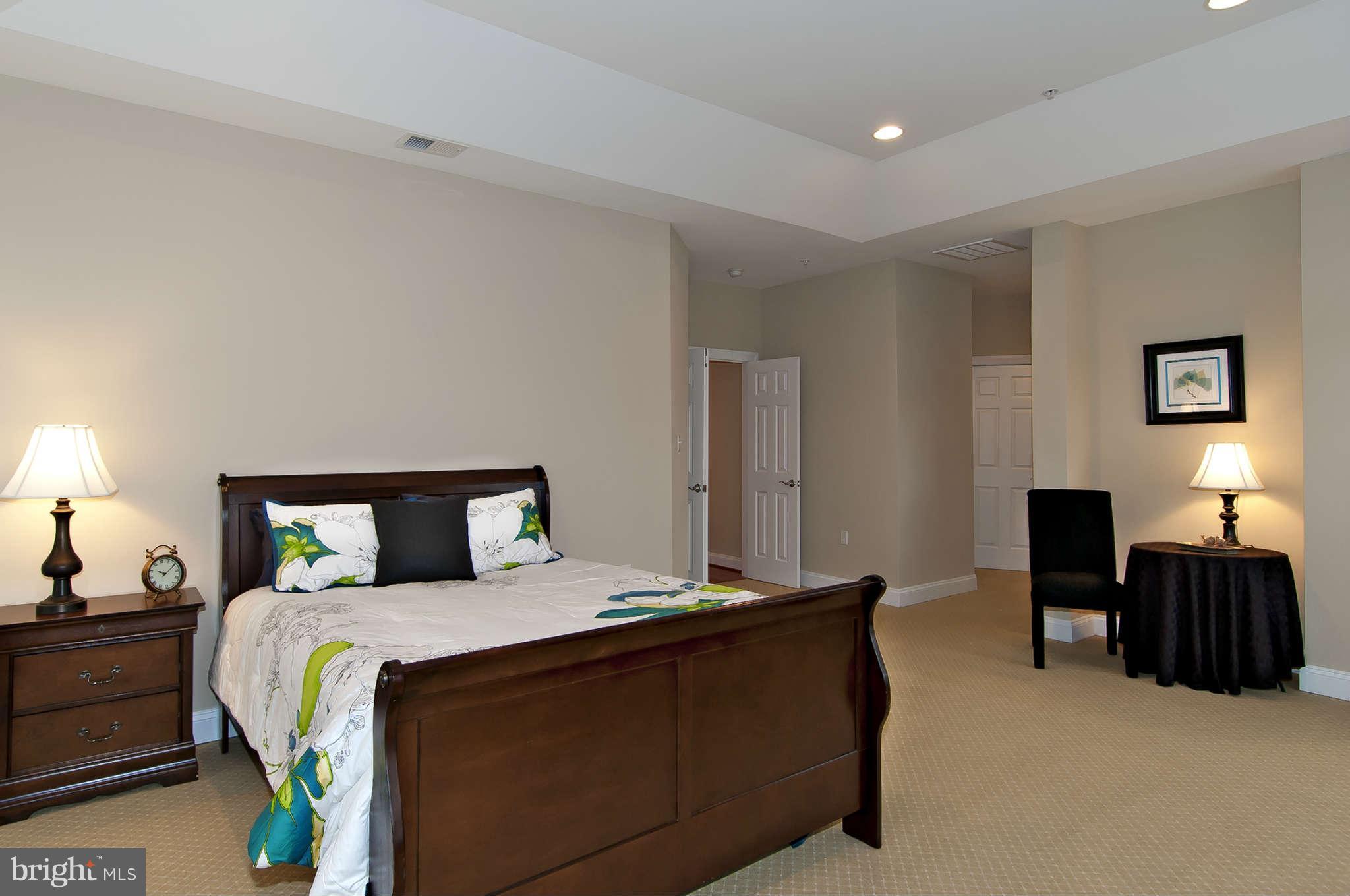8407 Old Georgetown Road Bethesda, MD 20814 - Photo 14 of 30 a bedroom with a bed and window