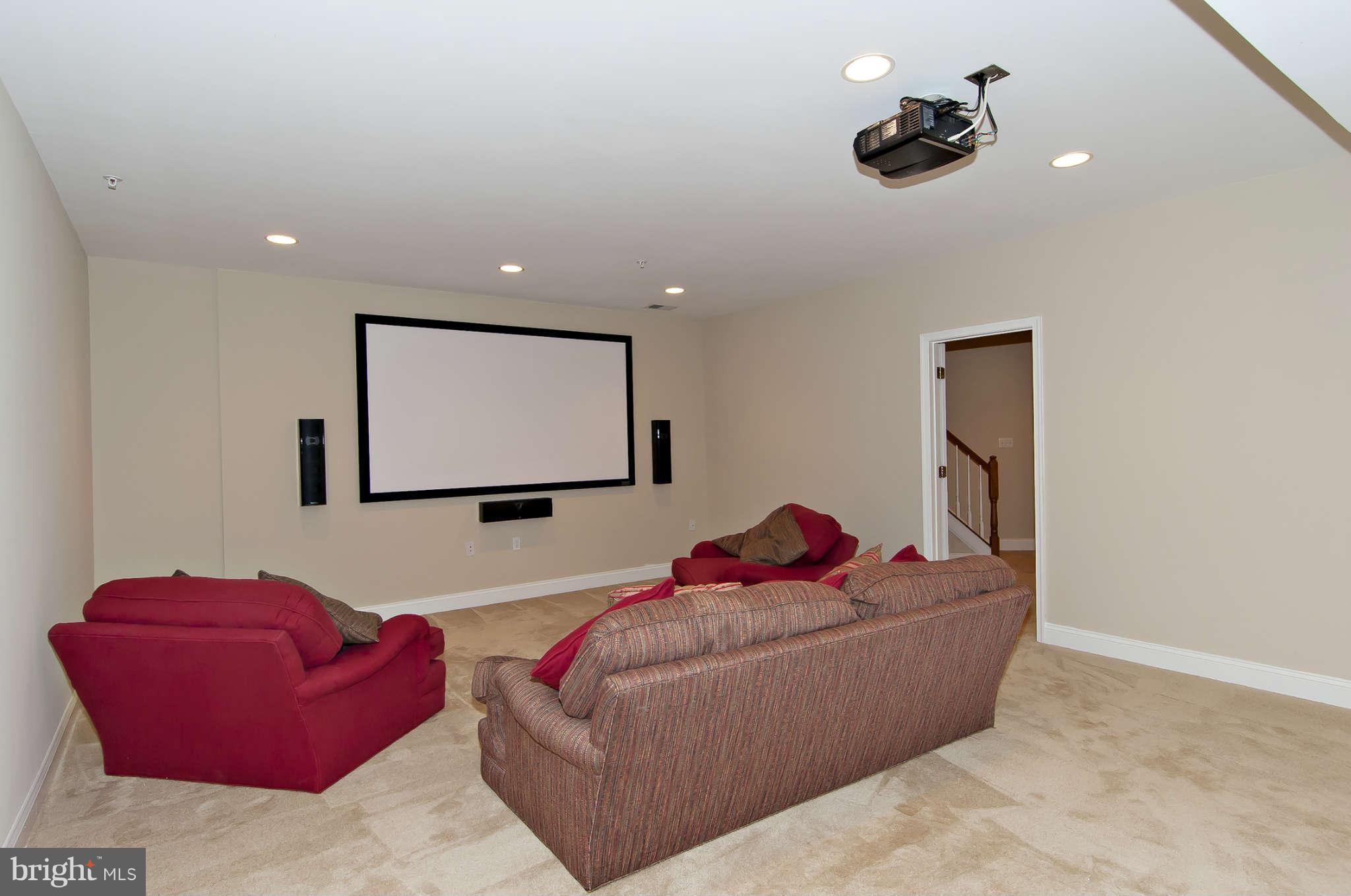 8407 Old Georgetown Road Bethesda, MD 20814 - Photo 23 of 30 a living room with furniture and a flat screen tv