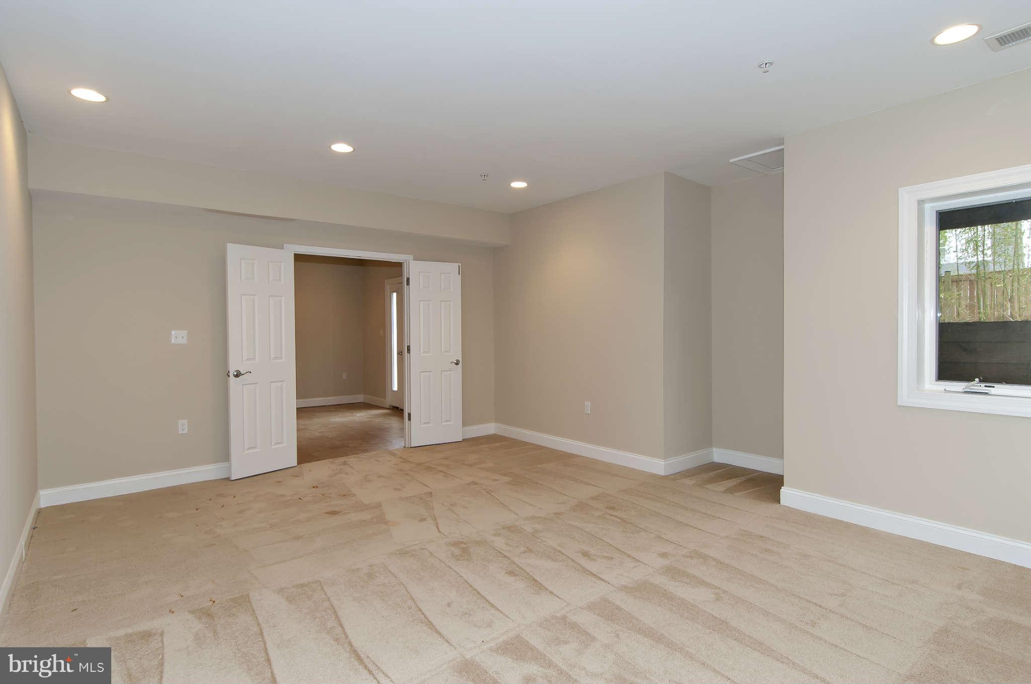 8407 Old Georgetown Road Bethesda, MD 20814 - Photo 26 of 30 a view of an empty room with closet and a window