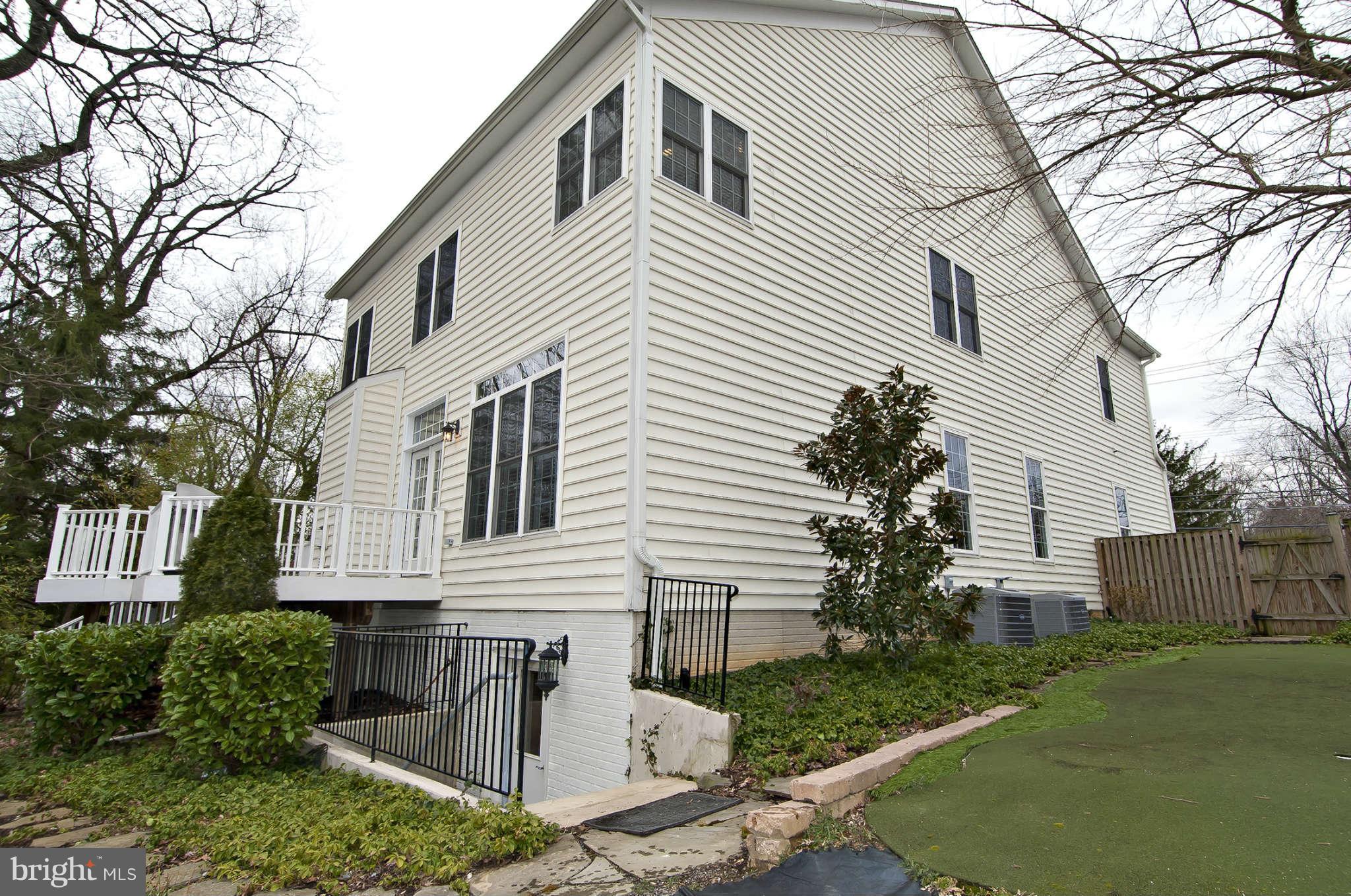 8407 Old Georgetown Road Bethesda, MD 20814 - Photo 30 of 30 a front view of a house with garden