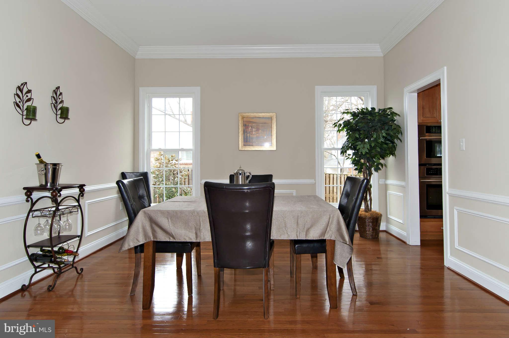 8407 Old Georgetown Road Bethesda, MD 20814 - Photo 5 of 30 a view of a dining room with furniture and wooden floor