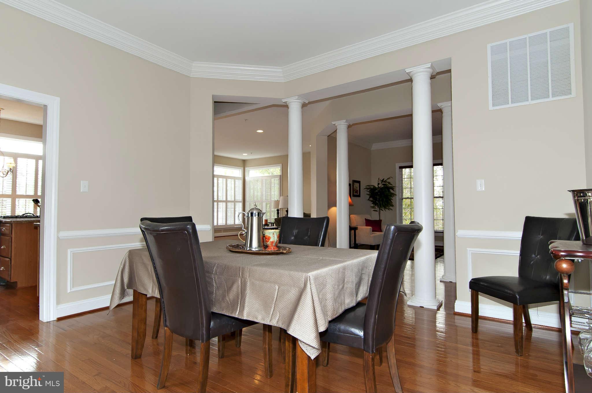 8407 Old Georgetown Road Bethesda, MD 20814 - Photo 6 of 30 a view of a dining room with furniture and wooden floor
