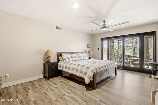 a spacious bedroom with a bed and a fireplace