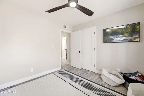 a utility room with dryer washer and a view of living room