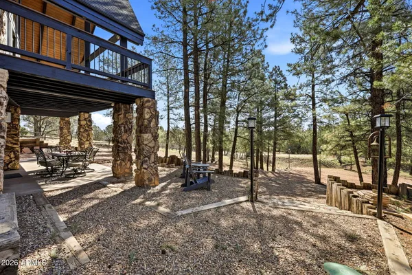 a view of a porch with furniture and garden