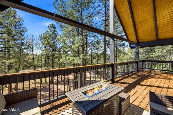 a view of balcony with wooden floor