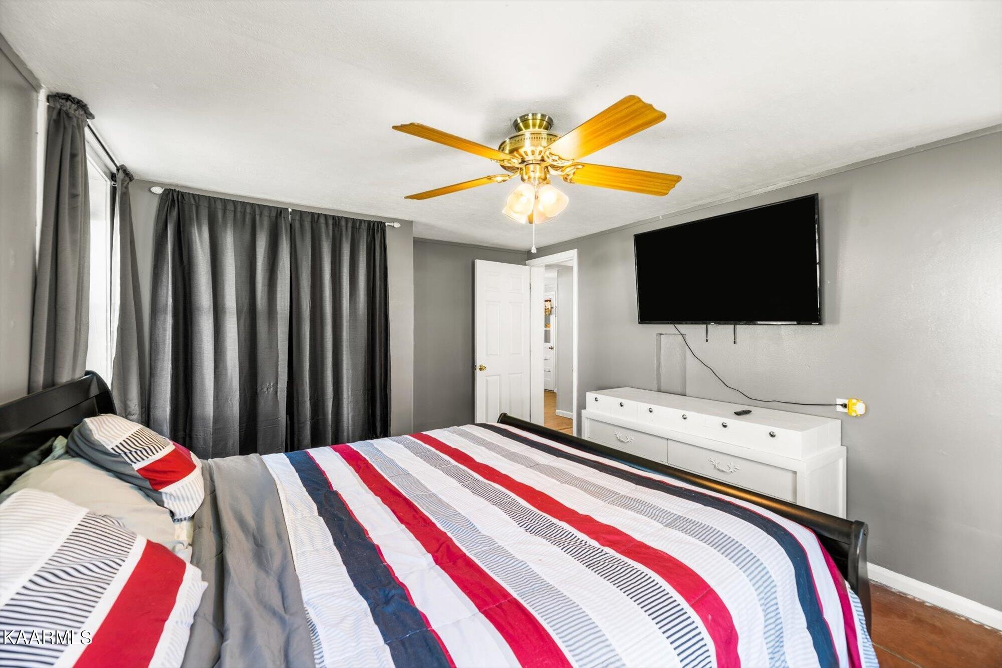 133 Oak Road Norris, TN 37828 - Photo 11 of 24 a bedroom with a bed and a flat screen tv