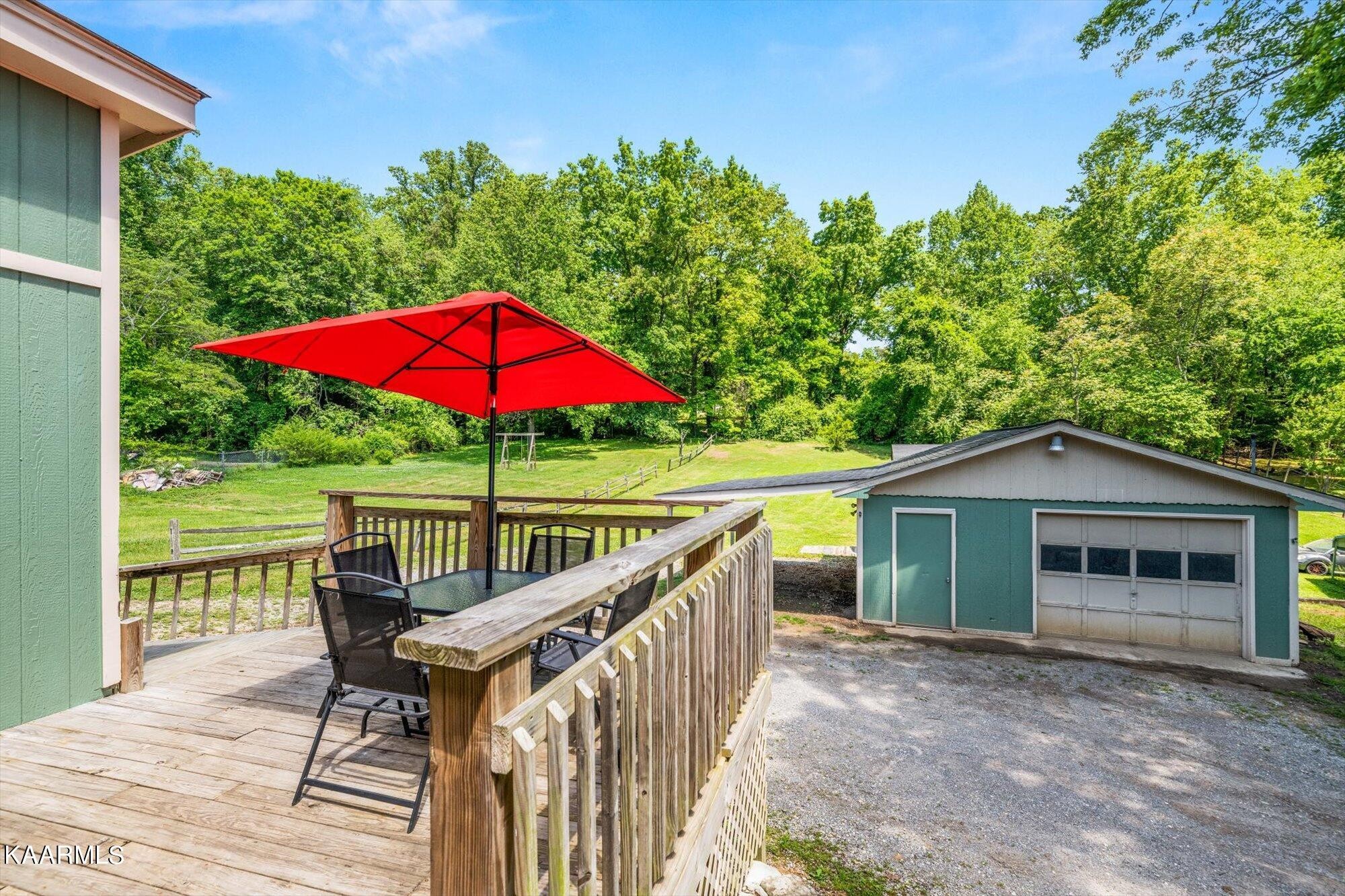 133 Oak Road Norris, TN 37828 - Photo 18 of 24 a view of a house with backyard and sitting area