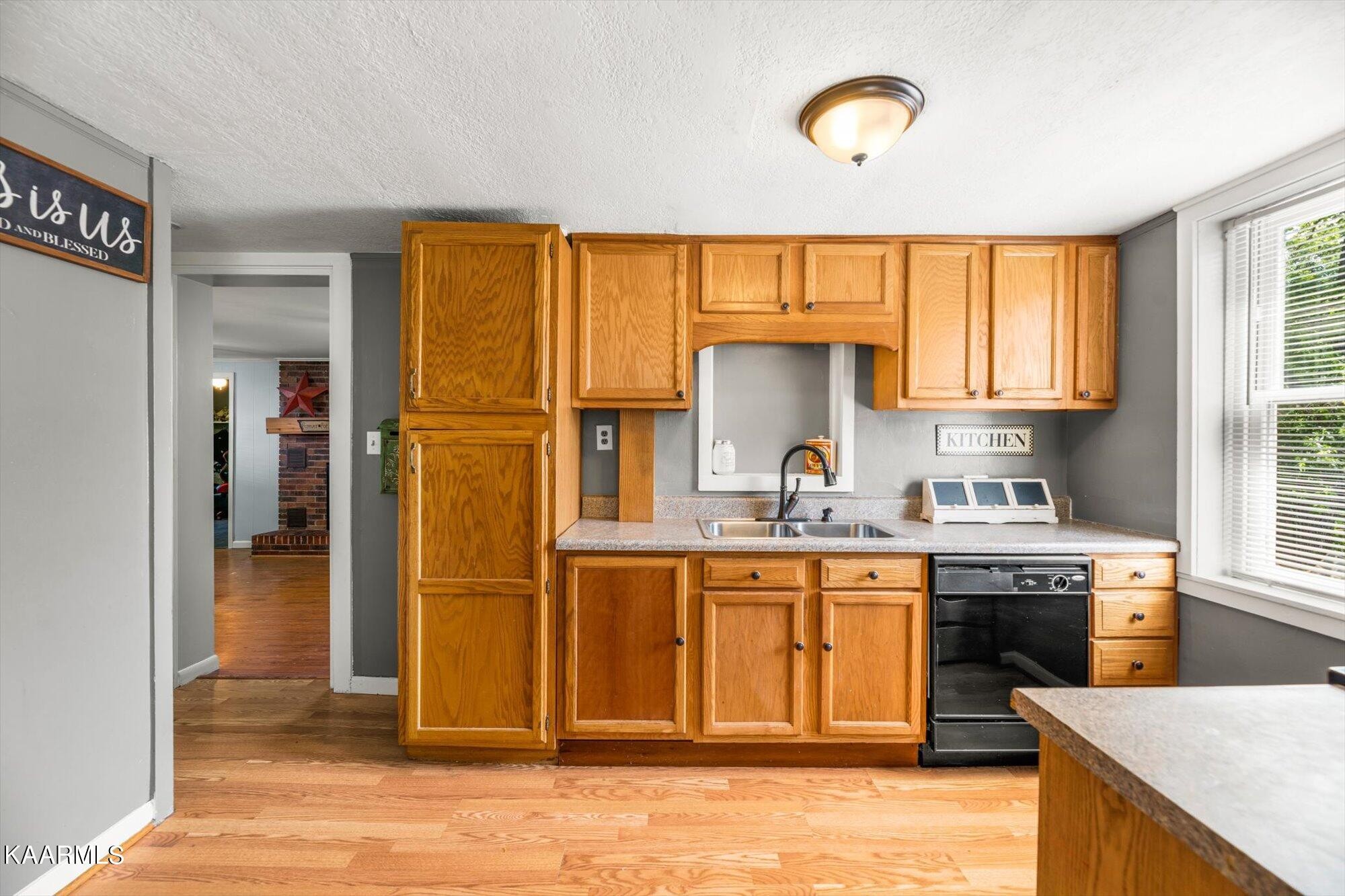 133 Oak Road Norris, TN 37828 - Photo 6 of 24 a kitchen with stainless steel appliances granite countertop a stove a sink dishwasher and a refrigerator