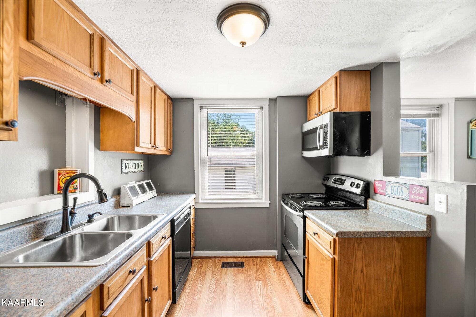 133 Oak Road Norris, TN 37828 - Photo 7 of 24 a kitchen that has a sink and a stove top oven