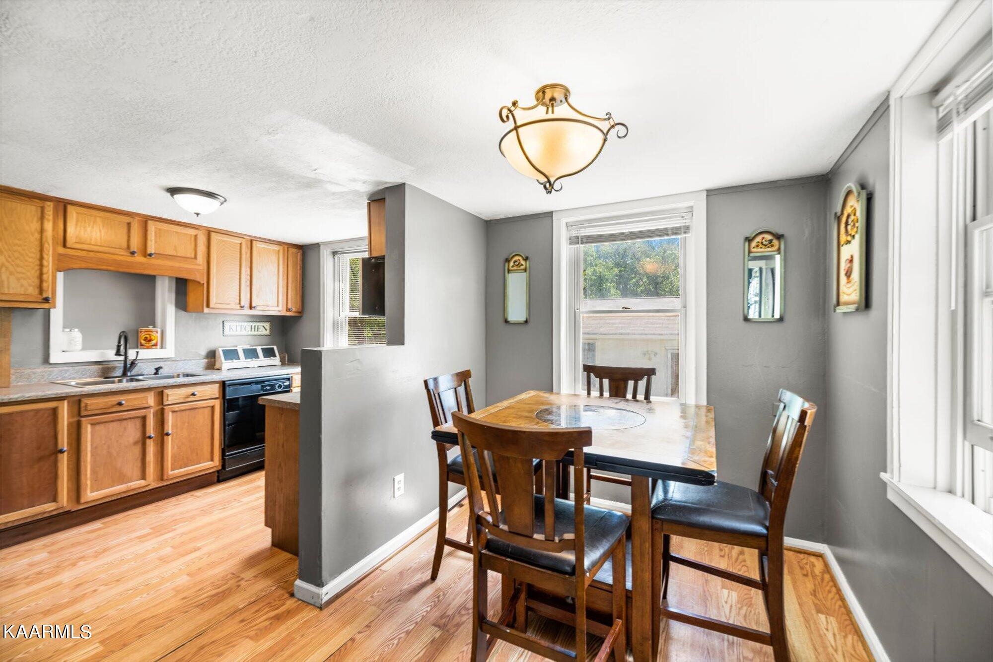 133 Oak Road Norris, TN 37828 - Photo 8 of 24 a view of a dining room with furniture window and wooden floor