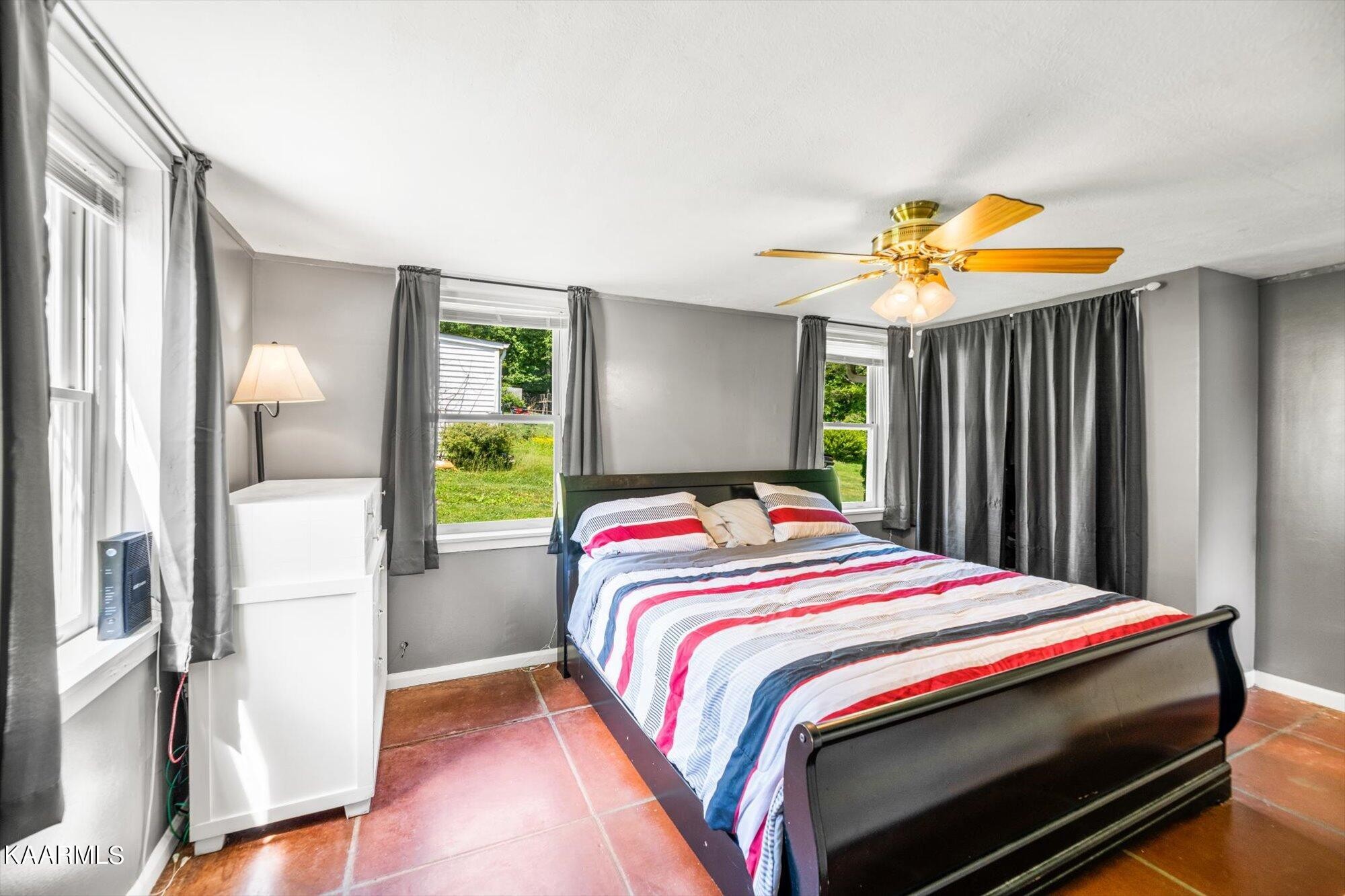 133 Oak Road Norris, TN 37828 - Photo 10 of 24 a bedroom with a bed and a window