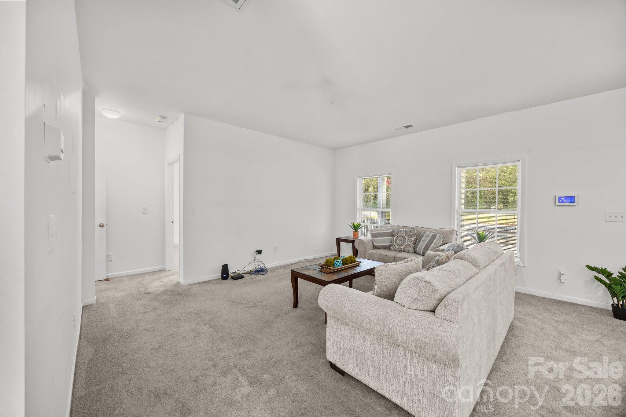 14532 East Rocky River Road Davidson, NC 28036 - Photo 15 of 32 a living room with furniture and a window
