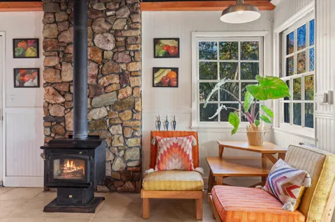 a outdoor living space with furniture and a rug