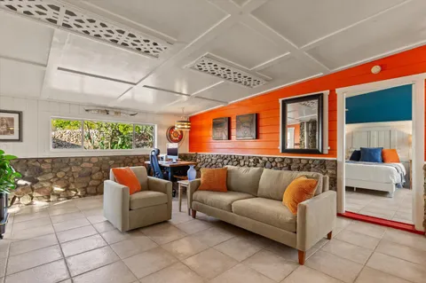 a living room with furniture and a gate