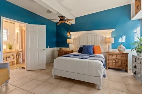 a bed room with a bed and a window