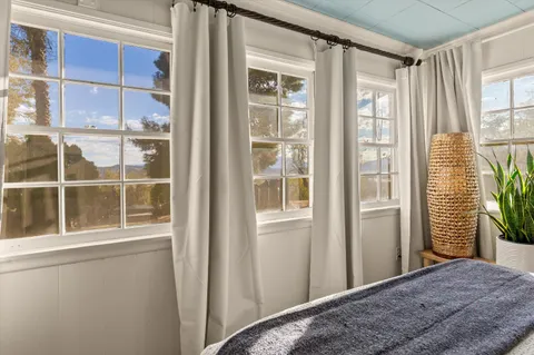 a backyard of a house with outdoor seating