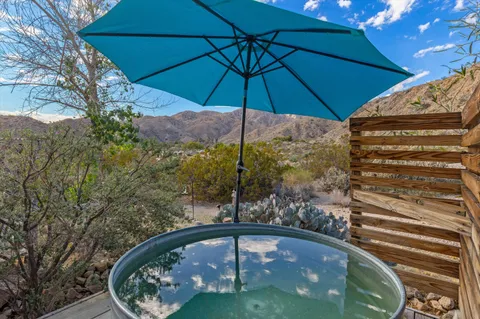 a view of a chairs and tables in the patio