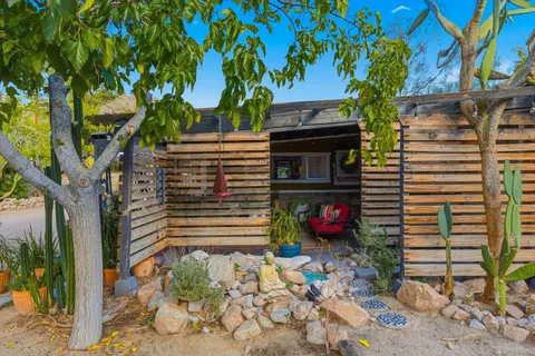 a view of a porch with furniture and a potted plant