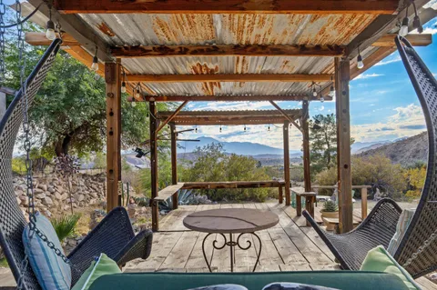 a patio with a patio table and chairs