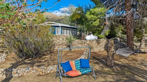 a view of a yard with a mountain