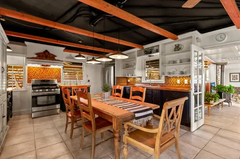 a view of an outside dining space with furniture