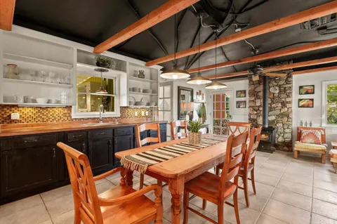 a outdoor living space with patio furniture and a fireplace