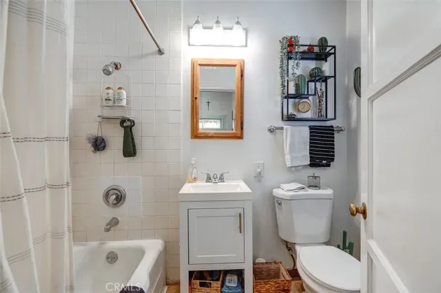a view of a kitchen with kitchen island granite countertop a stove and a sink
