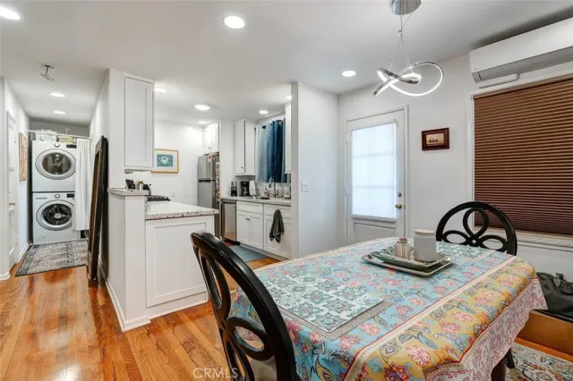 a bedroom with bed and wooden floor