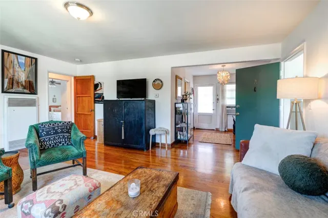 a bedroom with furniture and a large mirror