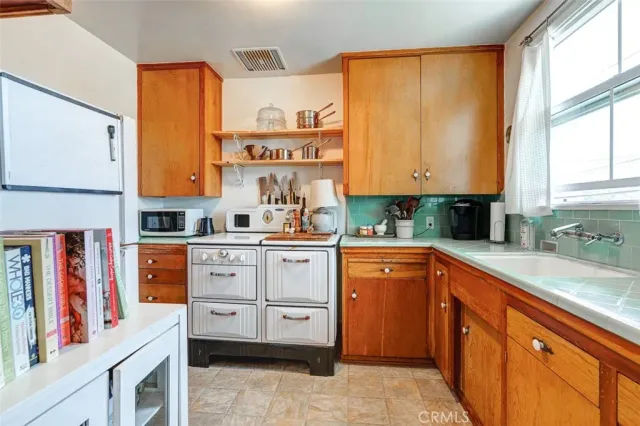 a bathroom with a toilet a sink and bathtub