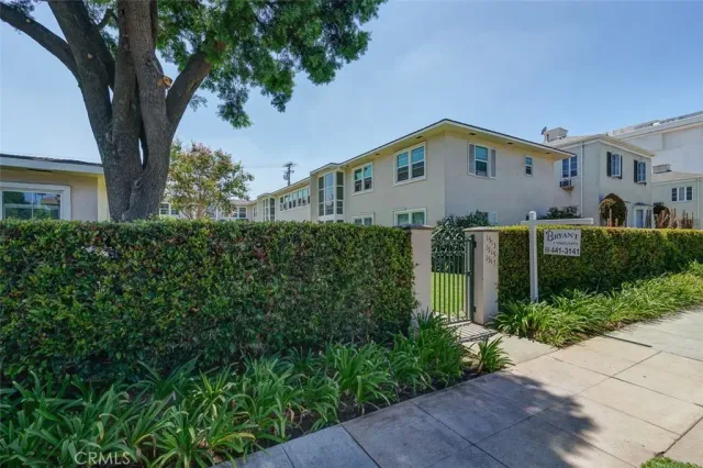 front view of a house with a garden