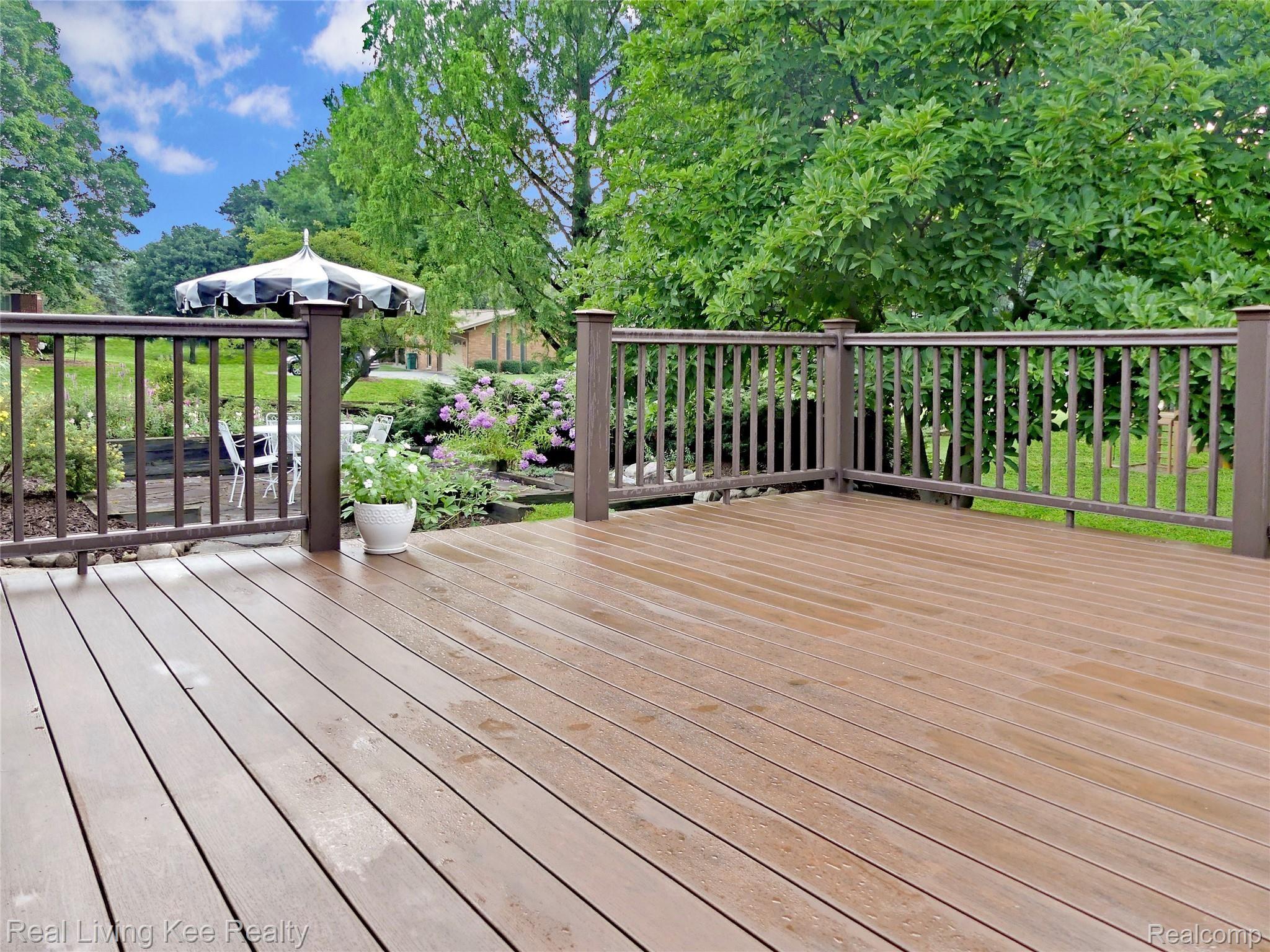 5165 Glengate Road Rochester, MI 48306 - Photo 35 of 38 Large Trex deck leads to patio