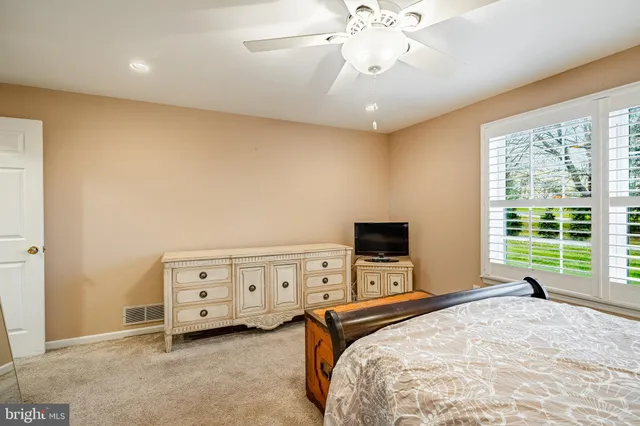 a bedroom with a bed and a tv