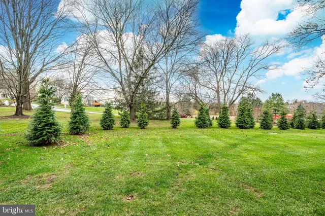 a front view of a residential apartment building with a yard